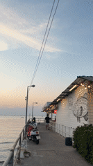 Evening seafood market bustles with vendors and shoppers in Pattaya