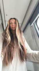 Woman films herself walking through Moscow train corridor