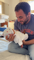 New father enjoys afternoon stroll with baby in Aprilia