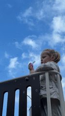 Child plays outdoors as luxury vehicle spotted in Khimki