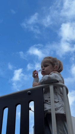 Child plays outdoors as luxury vehicle spotted in Khimki