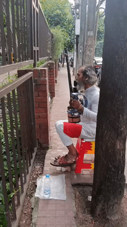 Everyday street life captured across Dhaka sidewalks and crossings
