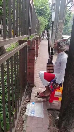 Everyday street life captured across Dhaka sidewalks and crossings