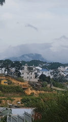Da Lat hillside: housing, logging sites, and a local cemetery