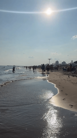 Summer evening at a New York beach with skyline views