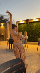 Belly dancer performs at outdoor restaurant in Noto, Italy