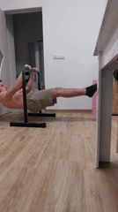 Man performs parallel bar workout during sunset in Burgas