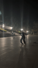 Young man skateboarding at night in Jiangjin, China