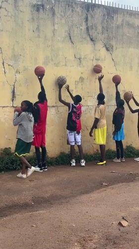 Basketball pickup game and drills on an outdoor court in Jos