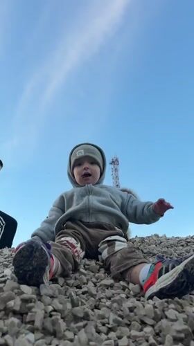Backyard afternoon with dogs, a toddler, and rural Russian life.