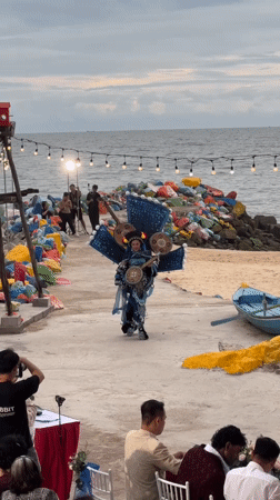 Ornate coastal costume along the beachside path in Phan Thiết