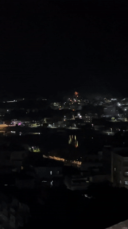 Fireworks display observed over Yenumula Palli cityscape