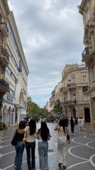 Afternoon foot traffic along a commercial pedestrian street in Baku
