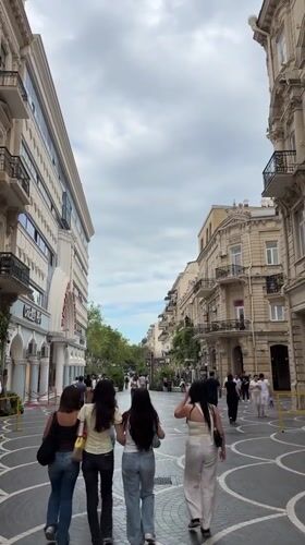 Afternoon foot traffic along a commercial pedestrian street in Baku
