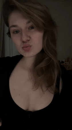 Person enjoys red drink at home in Kazan