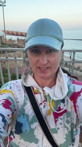 Woman documents early morning garden and beach visit in Netanya