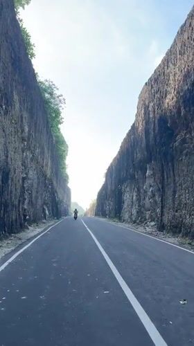 Late-night motorcycle ride filmed along Indonesia clifftop coastal road