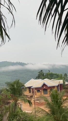 Morning fog blankets mountains in Achara, Nigeria