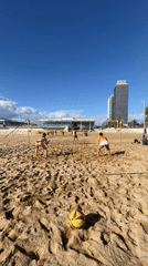 Morning beach volleyball game observed in Barcelona