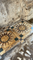 Tourist documents ancient interiors at Hadrian's Villa, Tivoli
