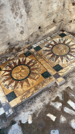 Tourist documents ancient interiors at Hadrian's Villa, Tivoli