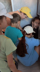 Children play and eat treats in Russian village afternoon
