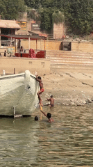 Early morning river boat activity captured in Varanasi