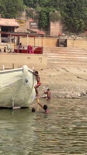 Early morning river boat activity captured in Varanasi