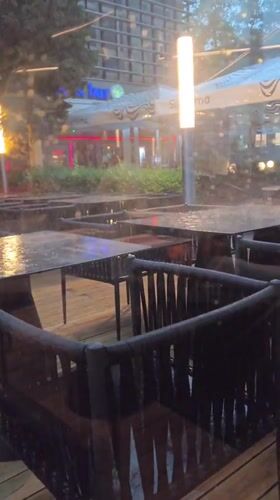 Heavy rainstorm hits Nesebar Bulgaria outdoor dining areas
