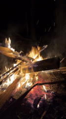 Evening gathering around bonfire in rural Russian village