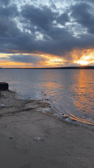 Dramatic sunset observed over water near Chaikovsky, Russia