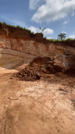 Man sorts through rocks in Igbarra, Nigeria
