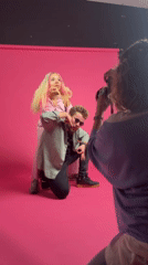 Paris studio photoshoot with pink backdrop documented by witnesses