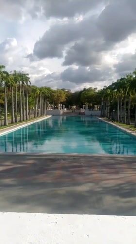 Evening visitors gather at Caracas memorial park and monument complex