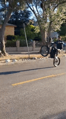 Motorcyclist performs wheelie on Los Angeles residential street