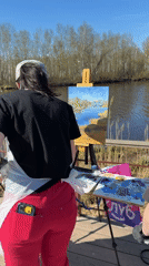 Artists paint landscapes outdoors near water in Saint Petersburg