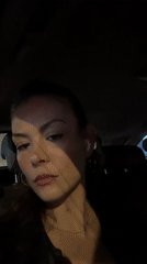 Woman observed in moving car backseat in London evening