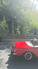 Red MGB convertible with Canadian flag spotted on Vancouver road