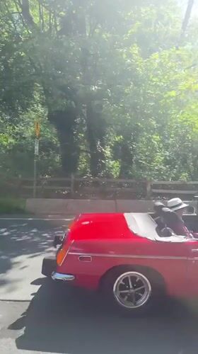 Red MGB convertible with Canadian flag spotted on Vancouver road