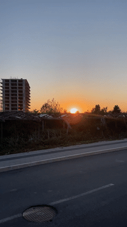 Casual moments captured in Bar: woman in car, sunny football field