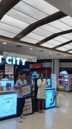 Street-level activity outside a Ko Samui shopping complex
