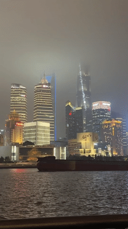 Shanghai residents document foggy Bund views, candy store visit