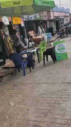 GLO telecommunications stall operates on busy Lagos street