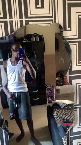Mirror selfie in a patterned bedroom, Lokoja