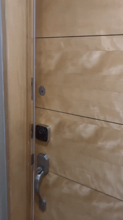 Man enters room smiling in Mexico City evening