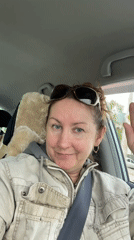 Driver waves at camera while driving in Barnaul