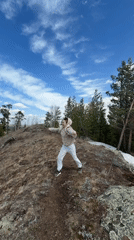 Person stands on hilltop in rural Russia