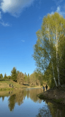 Spring flowers bloom around lake in Кадряково, Russia