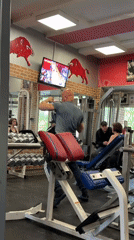 Man prepares workout equipment at Saint Petersburg gym