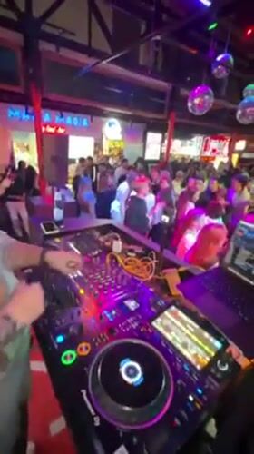 DJ performs at crowded Moscow sports bar nightclub